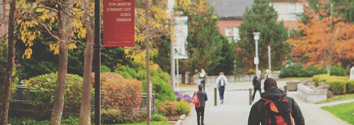 A student walks home after a day of class